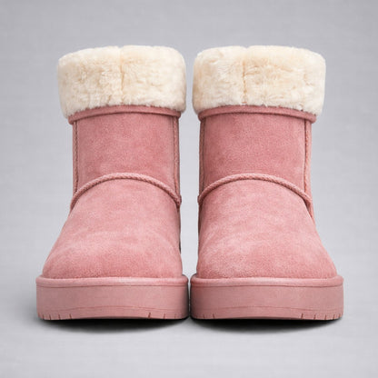 Pair of pink sheepskin winter boots with white merino wool fur lining.